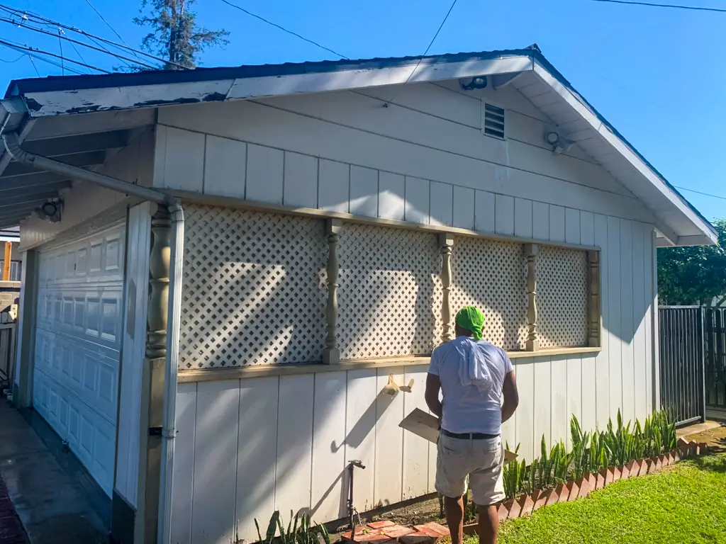 Before garage lattice painting San Gabriel exterior painting contractors working wood siding fascia board