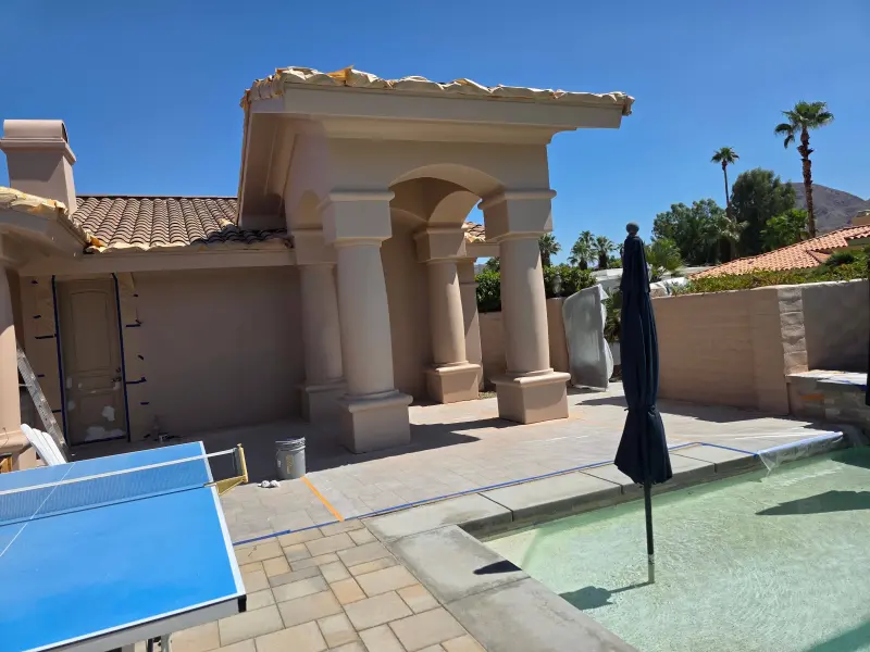 Newly painted exterior columns and patio walls at a luxury residential property in Indian Wells, CA 92210, showcasing a smooth, uniform finish.