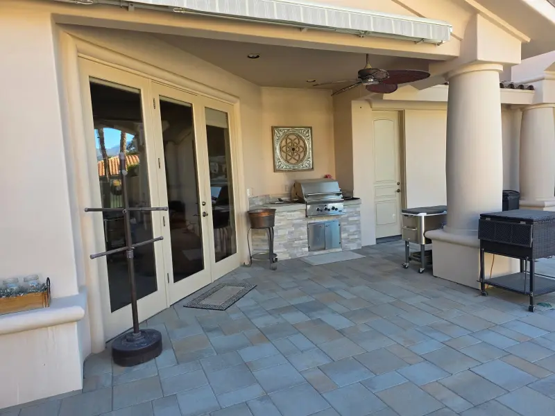 Freshly painted exterior patio doors, columns, and outdoor kitchen area at a residential property in Indian Wells, CA 92210.